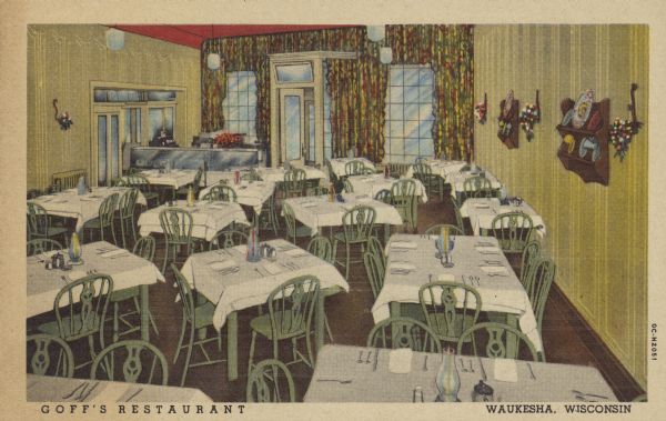 Text on front reads: "Goff's Restaurant, Waukesha, Wisconsin." On reverse: "Goff's Restaurant, Clinton Street - Waukesha, Wis. Wisconsin's Pioneer Restaurant. 59 years of service. Featuring home made pies, bread and steak. Smorgasbord every Thursday and Sunday evening. Recommended by Duncan Hines." The dining room is full of tables and chairs with place settings ready for guests. In the back of the room is the hostess stand on the left near the entrance which is fronted by large windows and colorful drapes. Plates on shelves and flowers in sconces decorate the walls.