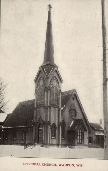 Text on front reads: "Episcopal Church, Waupun, Wis." Trinity Episcopal Church was built in 1871, of boards and batten, in the Gothic Revival style. It has many interesting architectural features. The same congregation has occupied the church since its founding.