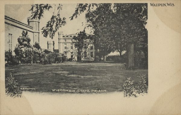 Text on front reads: "Wisconsin State Prison, Waupun, Wis." Gothic Revival buildings at the prison, built in 1854 of limestone, with a lawn and trees. The prison housed adult men and women until 1933, when a separate women's prison was built.