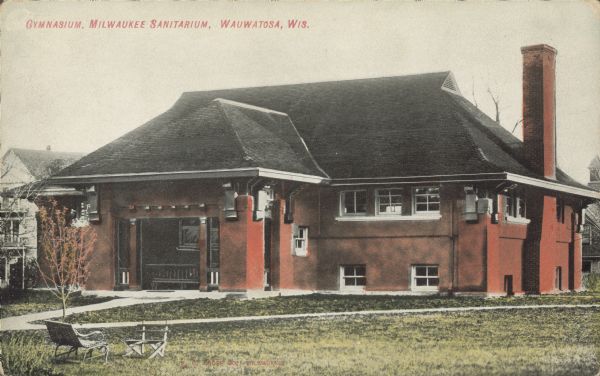 Text on front reads: "Gymnasium, Milwaukee Sanitarium, Wauwatosa, Wis." A brick gymnasium at the Milwaukee Sanitarium, a privately held institution for the treatment of nervous disorders.