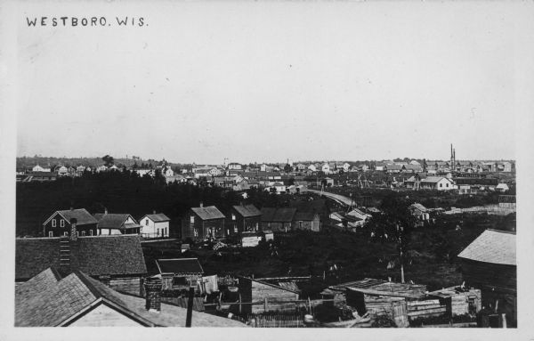 Text on front reads: "Westboro, Wis." Elevated view of Westboro with buildings and trees. Agricultural buildings are in the foreground.