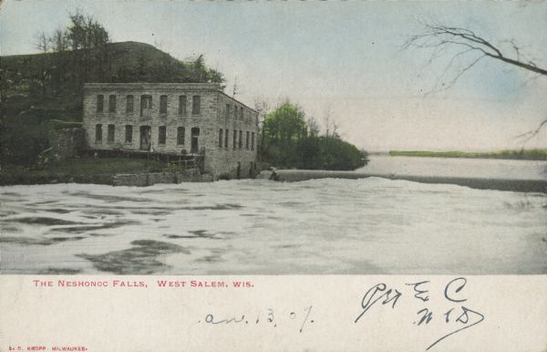 Text on front reads: "Neshonoc Falls, West Salem, Wis." The Neshonoc Dam, powerhouse and spillway on the La Crosse River. The powerhouse was built after 1895 by Alex McMillan. In 1940 a new dam was built. Today, the Neshonoc power station operates in that building.<p>Text of the Wisconsin Historical Society Marker Number 349, erected in 1997: "The nearby limestone grist mill and dam are the remnants of what once was a mid-19th century village located at this site. Vermont millwright and speculator Monroe Palmer purchased fifteen acres of land on the La Crosse River and constructed the dam and mill in 1852. Three years later, Palmer hired a surveyor to plat a village of eighteen blocks and 147 lots, which he called 'Neshonoc,' after the Ho-Chunk name for this place. Neshonoc was considered for the La Crosse County seat and a La Crosse and Milwaukee Railroad Company station, and soon businesses, a church, a school, and homes sprang up. The forward thinking Palmer and his brother, Dr. Horace Palmer, built two innovative Octagon houses near the river. But in 1858, the railroad bypassed Neshonoc, laying its line closer to the nearby Village of West Salem. Many residents of Neshonoc moved their homes and businesses there, and by the 1890s Neshonoc had almost disappeared from the landscape.</p>
