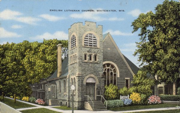 Text on front reads: "English Lutheran Church, Whitewater, Wis." A limestone church built in the Romanesque Revival style, surrounded by trees, lawns, sidewalks, shrubs and flowers. It is listed on the State and National Register of Historic Places. From the Property Record on the Wisconsin Historical Society website: "This church was officially organized in 1858. Services were held in various places such as Bower's Hall, a school house in Library Park, and in the East Side School. In 1869, after the Norwegian congregation was organized, a small white church was built on Cravath Street (Ole Bull Park). Masses were held here until 1908, when the current First English Lutheran Church was bought from the Baptists. This church was built in 1886." 