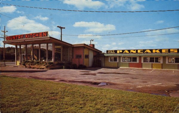 Text on reverse reads: "Country Kitchen. Wisconsin's Most Unique. A Dinner or a Snack – Plenty of Parking. Location: Hwy. 13 Exit on I-90-94 at intersection of Hwy. 12, 13, 16, and 23. 'Next to Fort Dells.' Wisconsin Dells, Wis." The Country Kitchen restaurant with a parking lot and lawn. Signs read: "Country Kitchen" and "Any Time Pancakes."