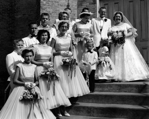 Loehrke and Zastrow wedding party in front of church.