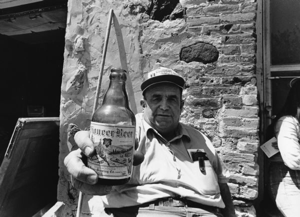 Gorden Senn displays a bottle that he purchased.