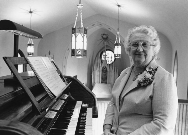 Mrs. William (Norma) Rahjes seated at her organ at St. Paul's Lutheran Church.