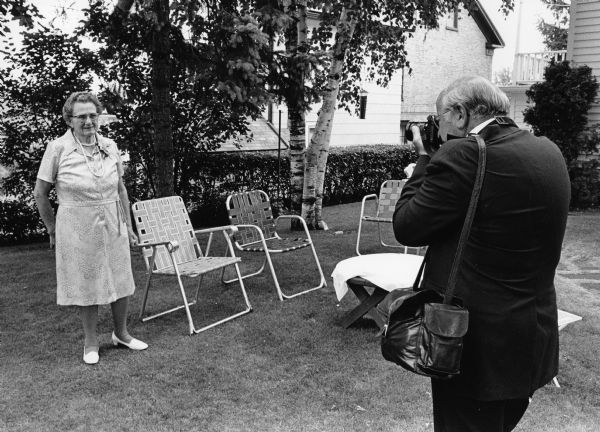 Dr. Greg Langenfeld photographs his aunt Clara Bandlow with his Leica camera.