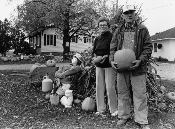 Milton and Adeline Retzlaff took time off from serving a steady stream of customers to pose with their merchandise.