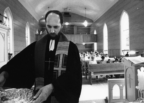 Pastor Aderman prepares for communion at St. Peters Lutheran Church in Theresa.