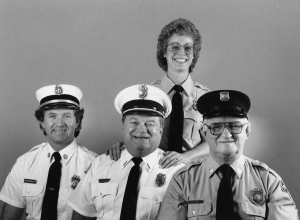 Theresa firemen: Bob and Dennis Bogenschneider and their father, Harvey. Photograph also includes Dennis' wife, Lorna.