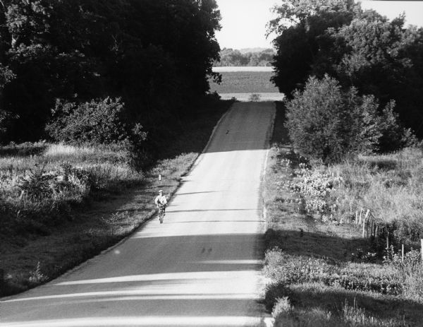 Shirley Widmer biking on McArthur Road.