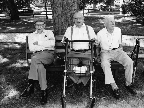Arnold Hartman, Les Beck, and Ralph Widmer lounging at ice cream social.