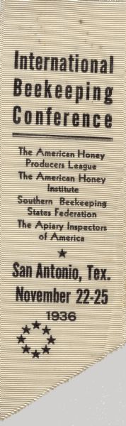 Badge for the International Beekeeping Conference, including The American Honey Producers League, The American Honey Institute, Southern Beekeeping States Federation, and The Apiary Inspectors of America. The conference was located in San Antonio, Texas on November 22-25, 1936.