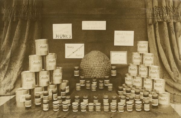 Honey display for Honey Week (November 19-25). W.E. Reim, C.E. Trout.
