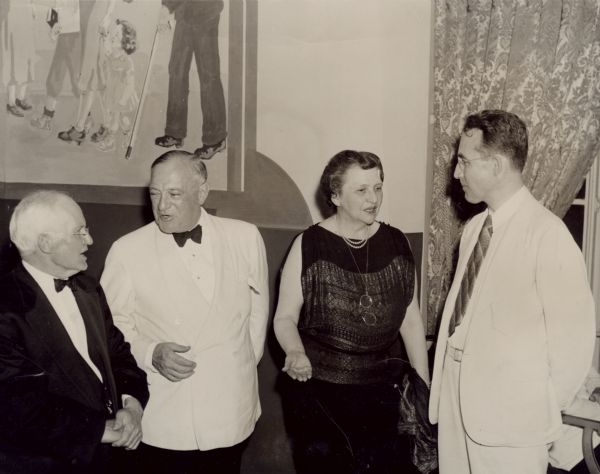 Banquet celebrating the third anniversary of the signing of the Social Security Act. From left to right: David J. Lewis, Congressman from Maryland, and Senator Robert F. Wagner of New York, co-sponsors of the Social Security Act; Secretary of Labor Frances Perkins and Arthur J. Altmeyer.
