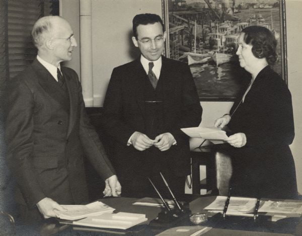 From left to right: George Bigge, Arthur Altmeyer, Chairman, and Ellen Woodward in an early meeting of the Social Security Board.