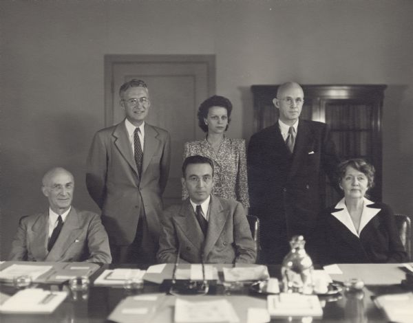 Back row from left to right: William Mitchell, Asst. Executive Director; Leona MacKinnon, Secretary to the Board; Oscar Powell, Executive Director.<p>Front row from left to right: George Bigge; Arthur Altmeyer, Chairman of the Board; Mrs. Ellen Woodward.