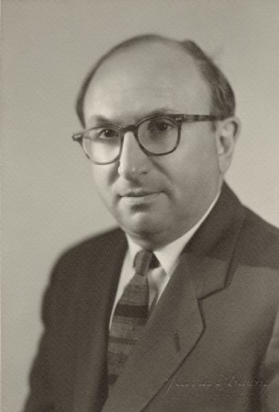 Quarter-length portrait of Wilbur J. Cohen, probably during his time as a Professor in Public Welfare Administration, School of Social Work, at the University of Michigan, Ann Arbor.