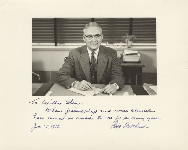 A portrait of William Mitchell, at his desk as Deputy Commissioner of Social Security. The photograph is inscribed,"To Wilbur Cohen: Whose friendship and wise counsel have meant so much to me for so many years. Jan 15, 1956. Bill Mitchell."
