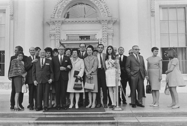 Group portrait of family and friends at Wilbur Cohen's swearing-in as Secretary of Health, Education and Welfare. From left to right: Bruce Cohen, Wilbur's second son; Angeline Badura Cohen, Aaron's second wife; Darwin Huxley; Robert Huxley; Aaron Cohen; Esther Huxley; Barbette Huxley; Wilbur J. Cohen; Vivian Becker, Eloise's sister; Eloise Cohen, Wilbur's wife; Chris Cohen, Wilbur's first son; Gladys King, Eloise's sister; Eliot Huxley; Lesley Huxley; three unidentified men; Fedle Fauri, Dean, University of Michigan, School of Social Work; Iris Fauri; Gretchen Fauri.<p>Social Security Administration was administered through the Department of Health, Education and Welfare by 1968.