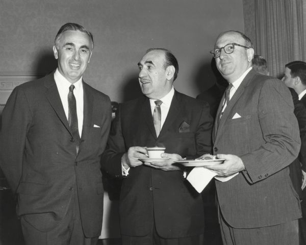 From left to right: Abraham A. Ribicoff, Anthony J. Celebrezze, and Wilbur J. Cohen at a reception. All three men served as Secretary of Health, Education and Welfare.