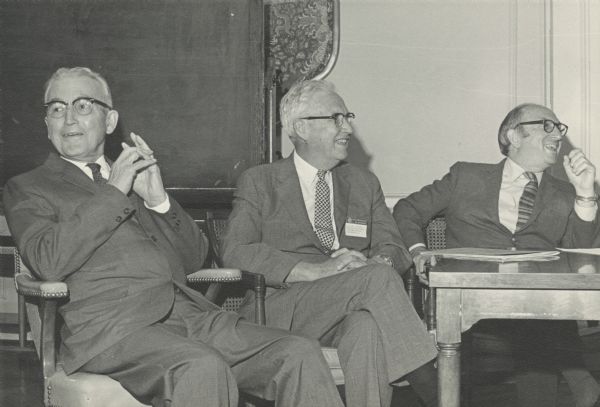 Arthur Altmeyer, William Mitchell and Wilbur Cohen laugh at remarks by someone not in the photograph. They are at a celebration of the 35th anniversary of the Social Security Act.