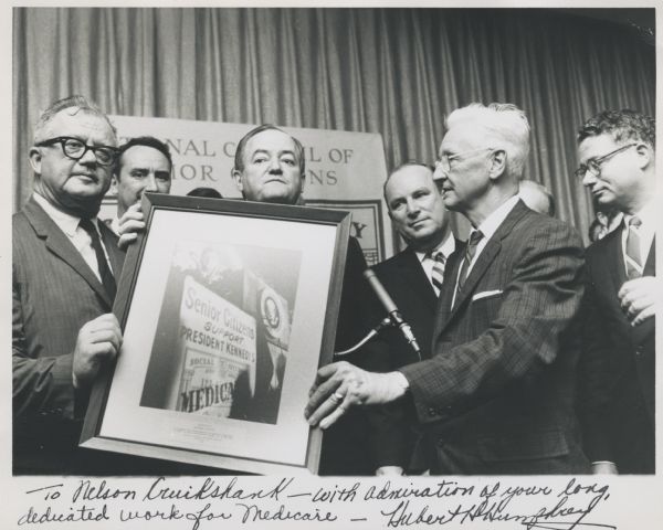 Nelson Cruikshank receives an award from Vice-President Hubert Humphrey for his work on Medicare. The photograph is inscribed by Hubert Humphrey: "To Nelson Cruikshank with admiration of your long, dedicated work for Medicare."<p>Nelson Cruikshank worked for the American Federation of Labor (AFL) from 1944 to 1965 in various roles, such as director of social insurance and later as Director of the AFL's Social Security Department. During this period he was very politically active in gaining support for Medicare and for Social Security Disability Insurance.