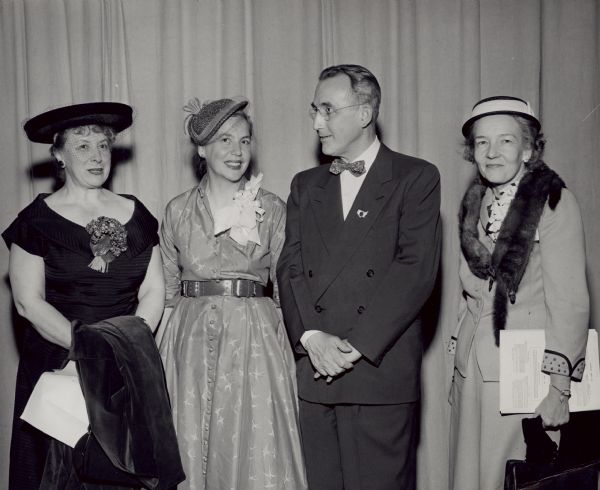 Elizabeth Wickenden, standing to the left of Arthur Altmeyer, was a social welfare and Social Security policy consultant, analyst, and writer, and professor of public policy and urban studies. Two women are unidentified.<p>She was a member of the federal Advisory Council on Public Welfare during the 1960s and President Kennedy's Task Force on Health and Social Security Legislation (1960-1961). As a consultant on public social policy, Wickenden analyzed and interpreted policy and legislation, studied problems, helped formulate goals and strategies, and promoted social action.<p>In 1978 she took on a leading role in the Study Group on Social Security and the Save Our Security Coalition.
