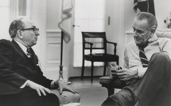 Wilbur Cohen and Lyndon B. Johnson having a relaxed but serious discussion.