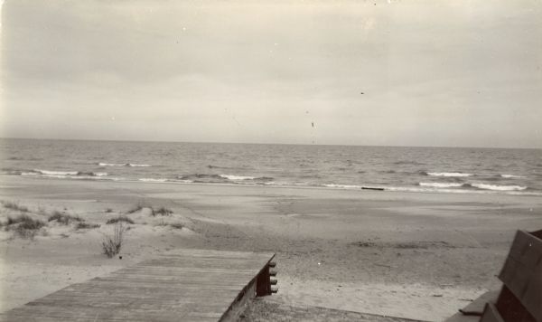 Beach at Terry Andrae State Park. There is a wooden boardwalk in the foreground.