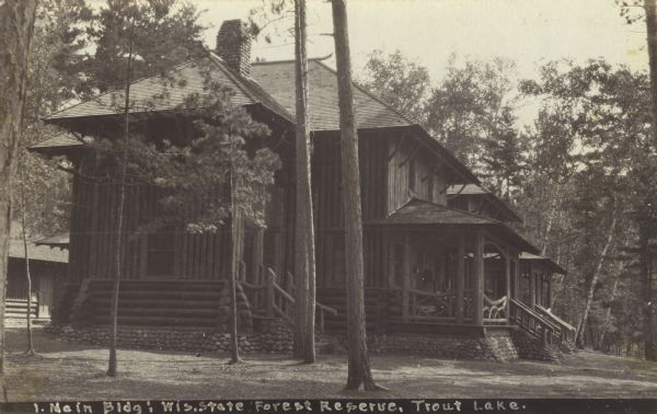 View of the main building at the Headquarters Camp State Board of Forestry at Trout Lake. This was the Headquarters of Field Instruction for Forest Ranger Students. Caption reads: "Main Bldg: Wisconsin State Forest Reserve, Trout Lake."