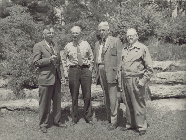 These four men from Wisconsin's Forests and Parks Department will retire in July 1958. C.L. (Neal) Harrington is second from the right.<p>A new retirement policy was adopted by the Conservation Commission in 1958. Twenty-six employees of the conservation department retired under the new policy in July 1958.