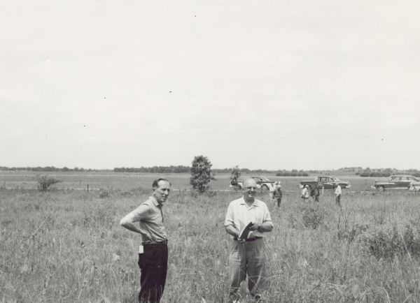 Members of the Board for the Preservation of Scientific Areas inspect the Scuppernong Prairie Scientific Area. The Board furnished this photograph for the 1958 Wisconsin Blue Book. C.L. (Neal) Harrington, wearing a dark shirt, is near the center of the photograph in the background. Automobiles are parked on a road behind the men. Scuppernong was designated a State Natural Area in 1952, a year after the formation of the Board for the Preservation of Scientific Areas.
