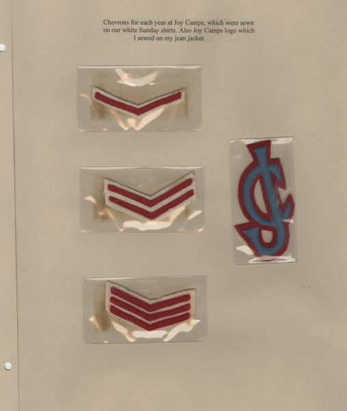 Page from Sue Ann Hackett Blue Album, displaying chevrons earned at camp, and the Joy Camps logo. Three different chevrons are included, a single, a double, and a triple, all red with white trim. The logo has a capital "J" superimposed over a capital "C"; the letters are in blue trimmed with red. Each of these items is stored in a small, transparent plastic envelope.