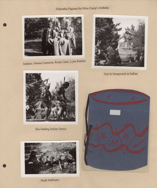 Page from Sue Ann Hackett Blue Album displaying several photographs and a homemade, pageant program. Includes scenes from the Hiawatha Pageant that campers put on to celebrate Miss Camp's birthday. Campers are dressed in costume and some are dancing. One photograph shows steaks cooking over a fire. The homemade pageant program measures 4.5 x 6 inches; the cover is made out of dark blue construction paper with red paint, depicting a drum, and interior pages (not visible here) are tied to the cover with black string.