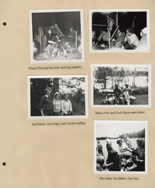 Page from Sue Ann Hackett Blue Album displaying several scenes from canoe trip. Includes photographs of campers at a campfire with a tent in the background, two campers sitting at a picnic table with a view of water behind them, three campers standing near trees, and a number of campers and a counselor gathered at the shoreline, some standing in the water; the opposite shore is in the background.