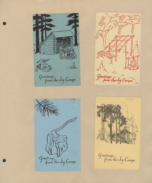Page from Sue Ann Hackett Blue Album displaying four Joy Camps postcards of different colors with different scenes depicted on each. Each postcard reads, "Greetings from the Joy Camps."