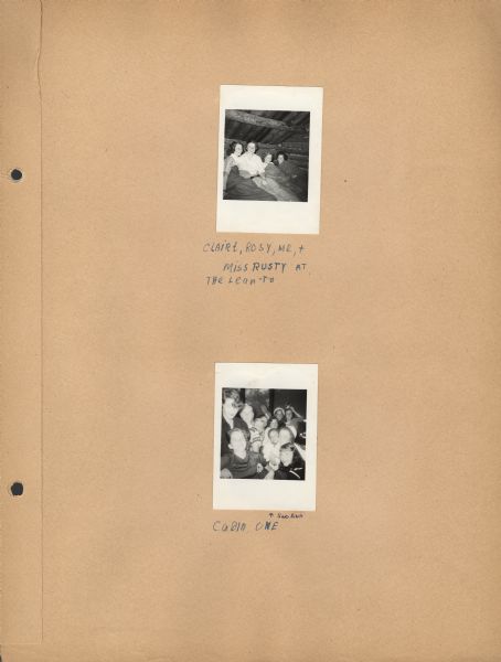 Page from Sue Ann Hackett Scrapbook displaying two photographs. One shows Sue Ann and two cabin mates, along with counselor Miss Rusty, in sleeping bags in the Lean-To. The other photograph is a duplicate of another photograph in this album of the Cabin I campers (interior view). The captions are handwritten in blue ink.