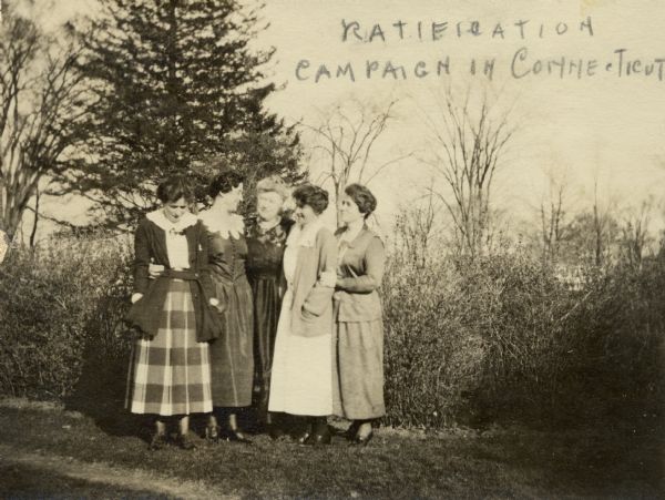 Five women, including Jessie Jack Hooper at center, pose together outdoors.