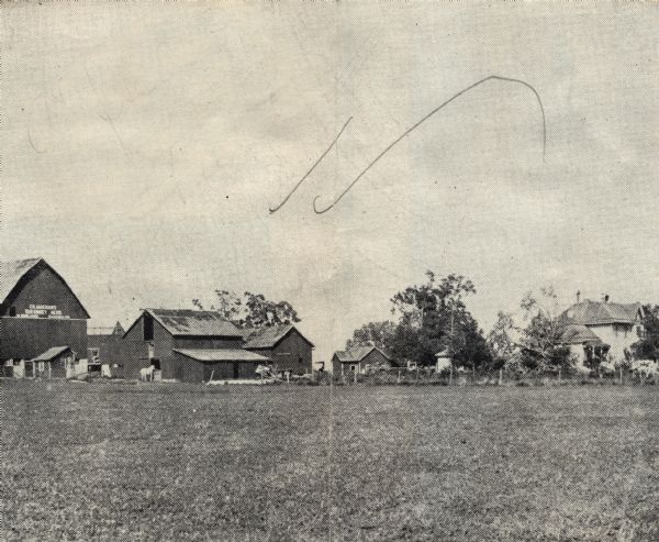View of barn, house, and outbuildings at Keystone Farms, owned by Owen W. Rolands.