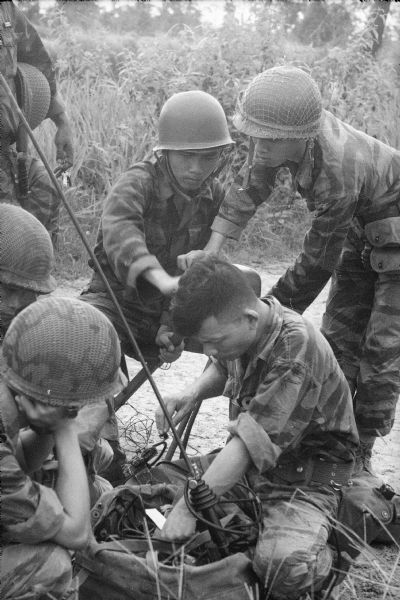 South Vietnamese Marines operating a radio in the field.