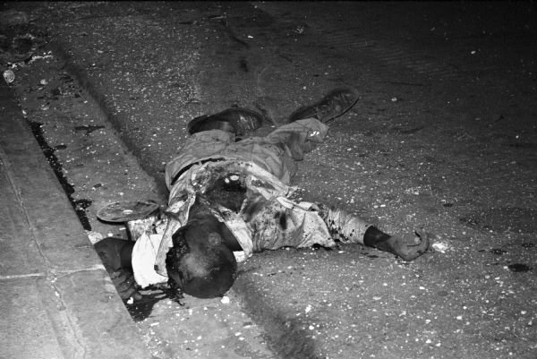body of a rebel tank crew member lying in the street in Santo Domingo, Dominican Republic.