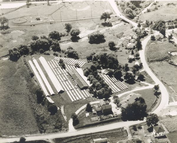 Aerial view of the Lakeside Mink Ranch, operated by Robert "Bud" Quinn. Spreading over 15 acres, the Ranch was one of the first operations to breed mink in captivity. The Ranch was shut down in 1977.