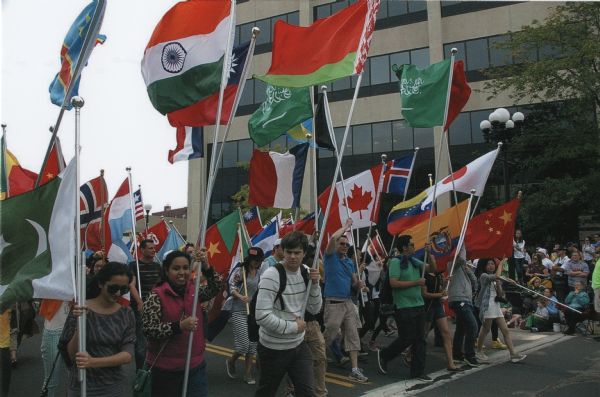 University of Wisconsin-La Crosse international students on parade with their national flags during the Mapleleaf Parade on 2nd Street, an Oktoberfest event.