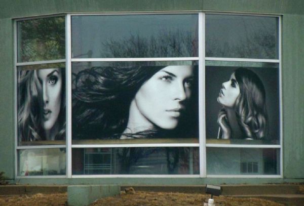 Beauty salon triptych in the window of the Sampson Building at the intersection of La Crosse & 4th Streets.