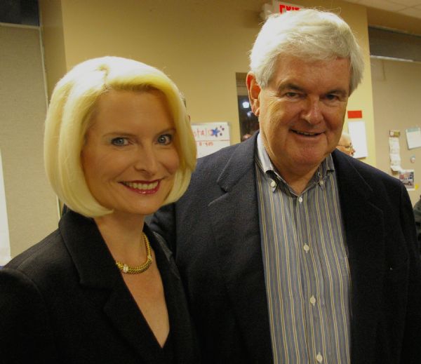 Callista and Newt Gingrich pose for a portrait as they enter a rally. They were the featured speakers at an event for the Republican Presidential ticket at the La Crosse County Republican Headquarters.