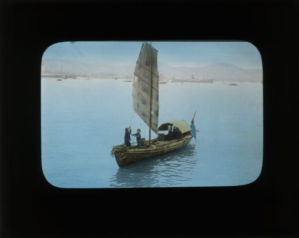 In her journal from China, Carrie describes a scene from the harbor: "There are a multitude of boats. The sails are colored like birch. The water under a clear sky is vividly blue".