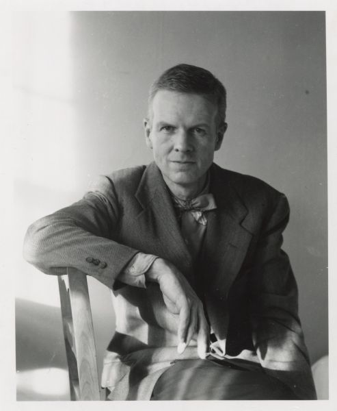 Waist-up portrait of Paul Vanderbilt sitting sideways on a chair. He was Curator of the Iconographic Collections, State Historical Society of Wisconsin.