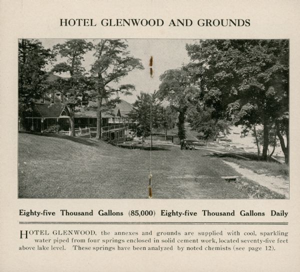 The centerfold of a promotional brochure features a photograph of the Hotel Glenwood and a description of the springs on the grounds. The hotel, with large lawn, has multiple gables and porches. The shore of Geneva Lake is just visible on the right; there are rowboats on the shore.